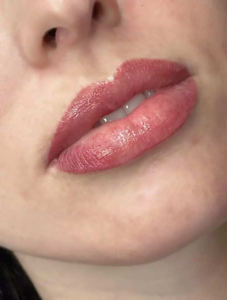 A close up of a woman's lips in a gallery.