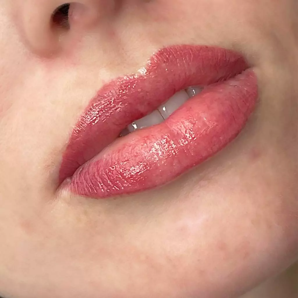 A close up of a woman's lips at home.